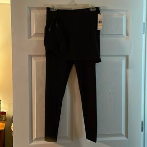 Calvin Klein Ankle Length Shirted Leggings. Adjustable on right side of skirt.